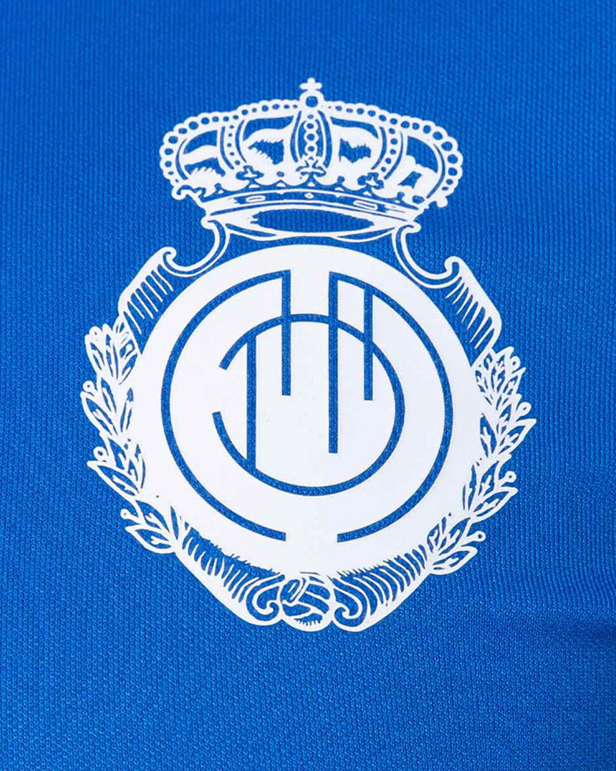 Samarreta d’entrenament infantil RCD Mallorca Player Training 2023-2024 de color blau reial i negre caribeny